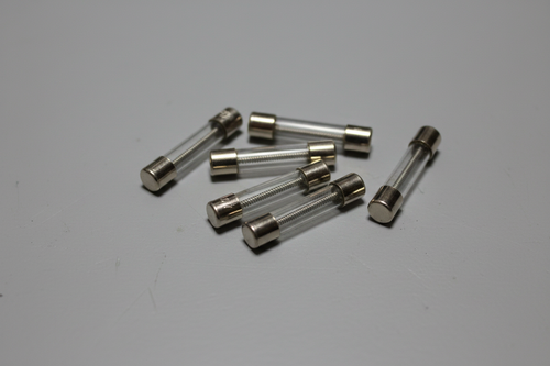 Glass Fuses on Gray Workbench